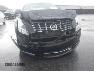 2013 Cadillac XTS Premium z VIN 2G61S5S39D9112491, wystawiony jako IAAI lot #42216373 z przebiegiem 145 338 mil mil oraz . Historia ofert i sprzedaży dostępna na DreamBid. Obrazek 6.