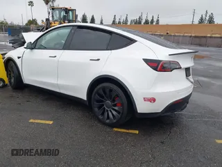 2022 Tesla Model Y Performance with VIN 7SAYGDEFXNF384268, listed as a IAAI auction lot 41558359 with 33,870 mi miles and . Bid and sale history available at DreamBid. Image 3.