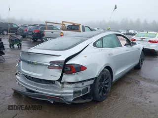 2014 Tesla Model S 60 with VIN 5YJSA1H18EFP30143, listed as a IAAI auction lot 42190505 with Not provided miles and . Bid and sale history available at DreamBid. Image 4.