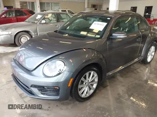 2018 Volkswagen Beetle S with VIN 3VWFD7AT6JM703758, listed as a IAAI auction lot 41381842 with 1 mi miles. Bid and sale history available at carsss.com. Image 2.