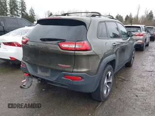 2015 Jeep Cherokee Trailhawk with VIN 1C4PJMBB5FW510514, listed as a IAAI auction lot 41492111 with 98,482 mi miles and . Bid and sale history available at DreamBid. Image 4.