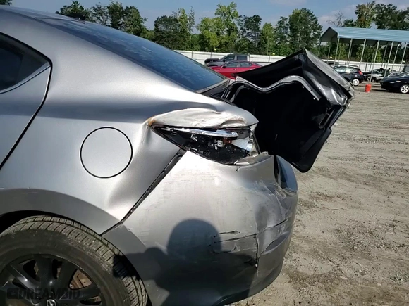 2015 Mazda Mazda3 i Grand Touring with VIN 3MZBM1W74FM124203, listed as a Copart auction lot 66877874 with 93,258 mi miles and Salvage Title. Bid and sale history available at carsss.com. Image 10.