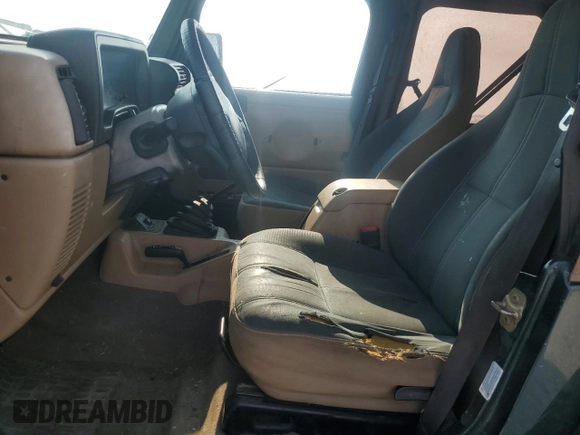 2002 Jeep Wrangler Sahara with VIN 1J4FA59S02P729015, listed as a Copart auction lot 63525745 with Not provided miles and Clean title. Bid and sale history available at DreamBid. Image 7.