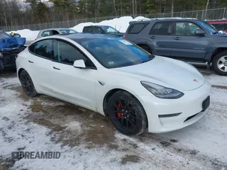 2020 Tesla Model 3 Standard Range Plus with VIN 5YJ3E1EA7LF742973, listed as a IAAI auction lot 41409285 with 48,993 mi miles and . Bid and sale history available at DreamBid. Image 1.