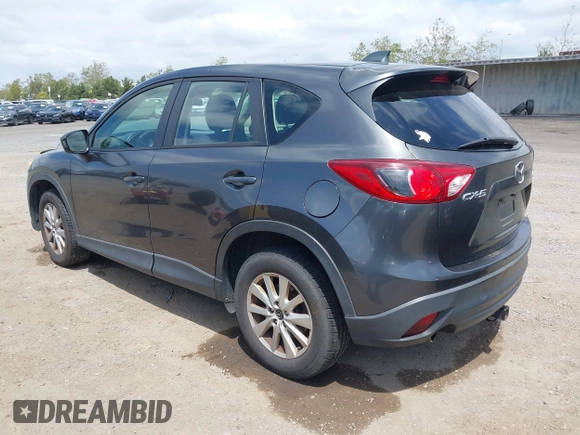 2014 Mazda CX-5 Sport with VIN JM3KE2BE0E0411377, listed as a IAAI auction lot 42143229 with 137,384 mi miles and . Bid and sale history available at carsss.com. Image 3.