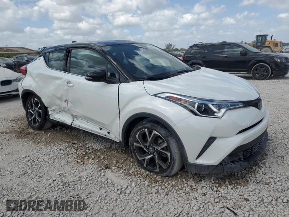 2019 Toyota C-HR XLE with VIN NMTKHMBX4KR100572, listed as a Copart auction lot 54371845 with 42,917 mi miles and Salvage Title. Bid and sale history available at DreamBid. Image 4.