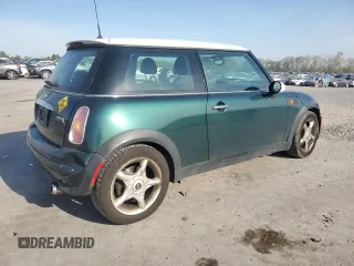 2004 MINI Hardtop with VIN WMWRC334X4TJ61391, listed as a Copart auction lot 53735615 with 103,974 mi miles and Salvage Title. Bid and sale history available at DreamBid. Image 3.