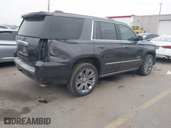2015 GMC Yukon Denali with VIN 1GKS2CKJ2FR705806, listed as a IAAI auction lot 41568322 with 171,011 mi miles. Bid and sale history available at carsss.com. Image 4.