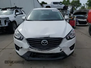 2016 Mazda CX-5 Touring with VIN JM3KE2CYXG0777715, listed as a Copart auction lot 52157005 with 58,585 mi miles and Salvage Title. Bid and sale history available at carsss.com. Image 5.