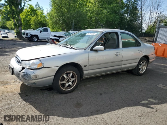 1998 Ford Contour LX with VIN 1FAFP66L2WK290948, listed as a Copart auction lot 56204295 with 76,307 mi miles and Salvage title. Bid and sale history available at DreamBid. Image 1.