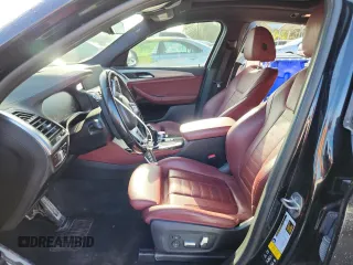 2021 BMW X4 M40i with VIN 5UX2V5C05M9F68427, listed as a Copart auction lot 64941095 with 50,208 mi miles and Salvage title. Bid and sale history available at DreamBid. Image 7.