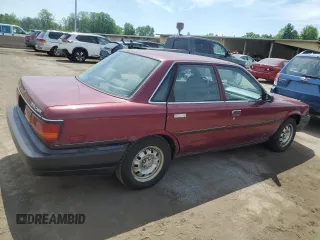 1991 Toyota Camry z VIN 4T1SV24E2MU387012, wystawiony jako Copart lot #57576164 z przebiegiem 117 436 mil mil oraz Nie do naprawy • Non repairable. Historia ofert i sprzedaży dostępna na DreamBid. Obrazek 3.