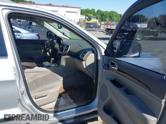2011 Jeep Grand Cherokee Laredo with VIN 1J4RS4GGXBC513523, listed as a IAAI auction lot 42203802 with 242,239 mi miles and . Bid and sale history available at DreamBid. Image 5.