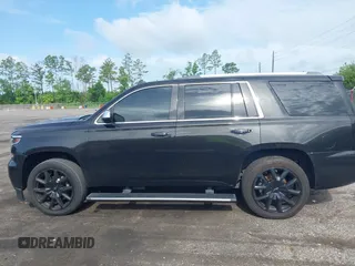 2015 Chevrolet Tahoe LTZ with VIN 1GNSCCKC5FR103676, listed as a IAAI auction lot 42456913 with 214,009 mi miles and . Bid and sale history available at DreamBid. Image 13.
