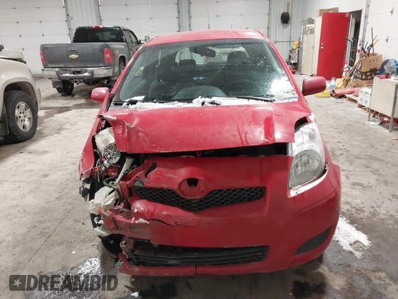 2009 Toyota Yaris with VIN JTDJT903695262292, listed as a IAAI auction lot 41636204 with 157,986 mi miles. Bid and sale history available at carsss.com. Image 12.