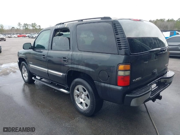 2005 GMC Yukon SLT with VIN 1GKEC13T75R144645, listed as a IAAI auction lot 41703999 with 222,585 mi miles. Bid and sale history available at carsss.com. Image 3.