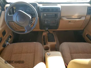 1998 Jeep Wrangler Sport with VIN 1J4FY19S0WP709843, listed as a Copart auction lot 74312254 with 147,010 mi miles and Salvage Title. Bid and sale history available at carsss.com. Image 8.