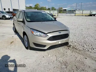 2018 Ford Focus SE z VIN 1FADP3FE8JL331853, wystawiony jako Copart lot #74013984 z przebiegiem 73 237 mil mil oraz Szkoda całkowita • Salvage title. Historia ofert i sprzedaży dostępna na DreamBid. Obrazek 14.