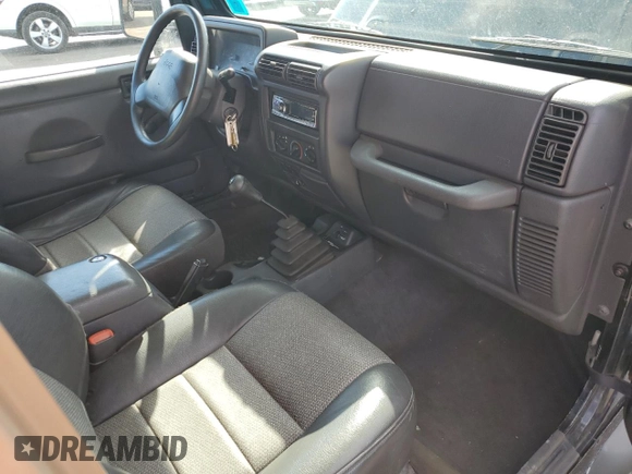 1999 Jeep Wrangler Sport z VIN 1J4FY19SXXP465037, wystawiony jako Copart lot #54772405 z przebiegiem 50 942 mil mil oraz Nie do naprawy • Non repairable. Historia ofert i sprzedaży dostępna na DreamBid. Obrazek 8.