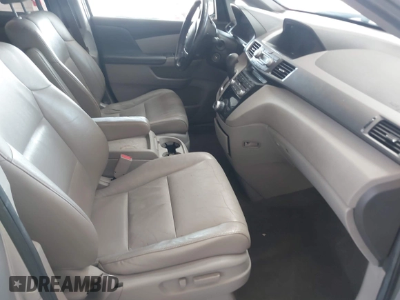 2012 Honda Odyssey EX-L with VIN 5FNRL5H67CB005013, listed as a IAAI auction lot 42295586 with 200,611 mi miles and . Bid and sale history available at DreamBid. Image 5.