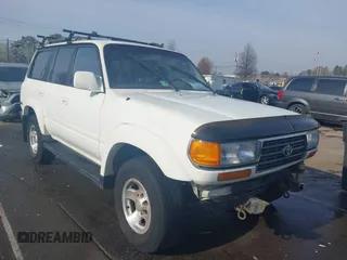 1995 Toyota Land Cruiser z VIN JT3DJ81W1S0101815, wystawiony jako IAAI lot #41787414 z przebiegiem 387 067 mil mil oraz . Historia ofert i sprzedaży dostępna na DreamBid. Obrazek 1.