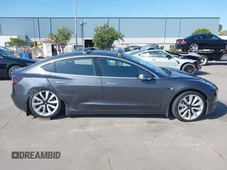2018 Tesla Model 3 Long Range Battery with VIN 5YJ3E1EA4JF024102, listed as a IAAI auction lot 42100621 with 86,298 mi miles and . Bid and sale history available at DreamBid. Image 12.