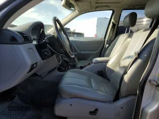 2000 Mercedes-Benz M-Class with VIN 4JGAB72E2YA185234, listed as a Copart auction lot 83479684 with 209,491 mi miles and Clean Title. Bid and sale history available at carsss.com. Image 7.