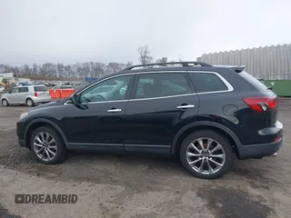 2015 Mazda CX-9 Grand Touring z VIN JM3TB3DV6F0464926, wystawiony jako IAAI lot #42035670 z przebiegiem 168 257 mil mil oraz . Historia ofert i sprzedaży dostępna na DreamBid. Obrazek 14.