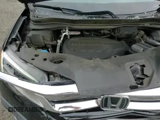 2021 Honda Pilot Touring 8-Passenger с VIN 5FNYF6H95MB045000, выставлен на аукционе Copart как лот 67716375 с пробегом 101 660 миль миль и Списание • Salvage title. История ставок и продаж доступна на DreamBid. Изображение 16.