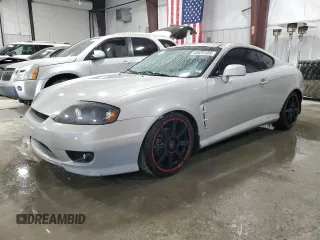 2006 Hyundai Tiburon GT z VIN KMHHN65F96U203924, wystawiony jako Copart lot #43624185 z przebiegiem 120 403 mil mil oraz Szkody całkowita. Historia ofert i sprzedaży dostępna na DreamBid. Obrazek 1.