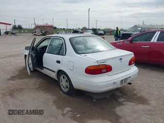 1999 Chevrolet Prizm z VIN 1Y1SK5487XZ439374, wystawiony jako IAAI lot #41746472 z przebiegiem 152 674 mil mil oraz . Historia ofert i sprzedaży dostępna na DreamBid. Obrazek 3.