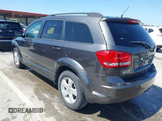 2014 Dodge Journey SE with VIN 3C4PDCAB7ET136799, listed as a IAAI auction lot 41972348 with 163,357 mi miles. Bid and sale history available at carsss.com. Image 3.