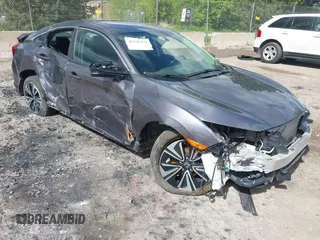 2018 Honda Civic EX-L z VIN 19XFC1F77JE000467, wystawiony jako IAAI lot #42345479 z przebiegiem Nie podano mil oraz . Historia ofert i sprzedaży dostępna na DreamBid. Obrazek 1.