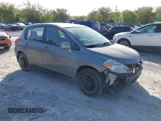 2012 Nissan Versa S with VIN 3N1BC1CP8CK242212, listed as a IAAI auction lot 42027327 with 117,118 mi miles. Bid and sale history available at carsss.com. Image 1.