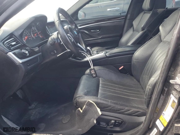 2014 BMW M5 with VIN WBSFV9C52ED593005, listed as a Copart auction lot 73960374 with 71,154 mi miles and Salvage Title. Bid and sale history available at carsss.com. Image 7.