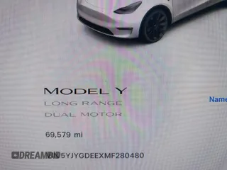 2021 Tesla Model Y Long Range with VIN 5YJYGDEEXMF280480, listed as a IAAI auction lot 41993633 with 69,579 mi miles. Bid and sale history available at carsss.com. Image 7.