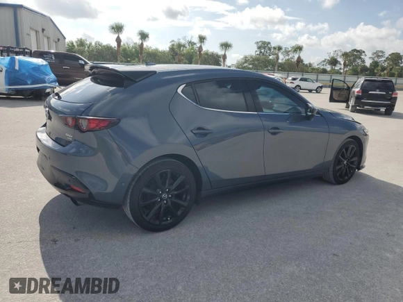 2021 Mazda 3 Premium Plus with VIN JM1BPBNYXM1403126, listed as a Copart auction lot 59971535 with 56,952 mi miles and Salvage title. Bid and sale history available at DreamBid. Image 3.