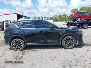2023 Mazda CX-5 2.5 S Premium Plus Package with VIN JM3KFBEM5P0256652, listed as a IAAI auction lot 41936376 with 31,332 mi miles. Bid and sale history available at carsss.com. Image 13.