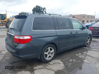 2005 Honda Odyssey TOURING with VIN 5FNRL38895B061480, listed as a IAAI auction lot 41807150 with 190,261 mi miles. Bid and sale history available at carsss.com. Image 4.