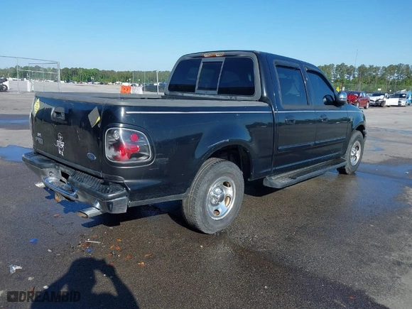 2001 Ford F-150 SuperCrew XLT with VIN 1FTRW07W41KA13131, listed as a IAAI auction lot 41922077 with 1 mi miles. Bid and sale history available at carsss.com. Image 4.