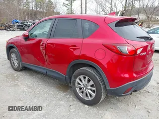2016 Mazda CX-5 Touring z VIN JM3KE2CY3G0894441, wystawiony jako IAAI lot #41508767 z przebiegiem 88 554 mil mil oraz . Historia ofert i sprzedaży dostępna na DreamBid. Obrazek 3.