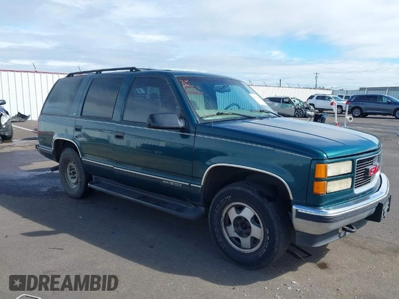 1999 GMC Yukon with VIN 1GKEK13R3XJ717999, listed as a IAAI auction lot 41870187 with 179,855 mi miles. Bid and sale history available at carsss.com. Image 1.