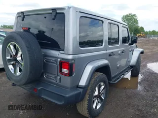 2019 Jeep Wrangler Unlimited Sahara with VIN 1C4HJXEN5KW542403, listed as a IAAI auction lot 42159197 with 60,378 mi miles and . Bid and sale history available at DreamBid. Image 4.
