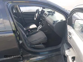 2010 Dodge Caliber SXT with VIN 1B3CB4HAXAD651644, listed as a IAAI auction lot 42173361 with 195,480 mi miles and . Bid and sale history available at DreamBid. Image 5.