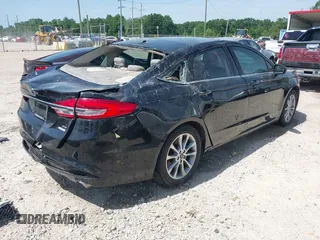 2017 Ford Fusion SE z VIN 3FA6P0HDXHR198388, wystawiony jako IAAI lot #42231069 z przebiegiem 143 709 mil mil oraz . Historia ofert i sprzedaży dostępna na DreamBid. Obrazek 4.