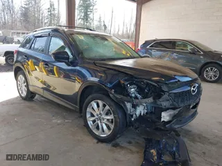 2014 Mazda CX-5 Grand Touring with VIN JM3KE2DY6E0394172, listed as a IAAI auction lot 41698468 with 89,554 mi miles. Bid and sale history available at carsss.com. Image 1.