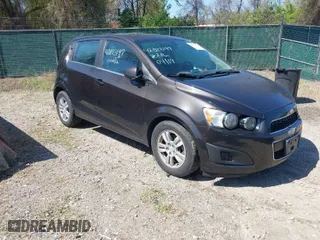 2014 Chevrolet Sonic LT with VIN 1G1JC6SB6E4210561, listed as a IAAI auction lot 42073197 with 100,945 mi miles. Bid and sale history available at carsss.com. Image 1.