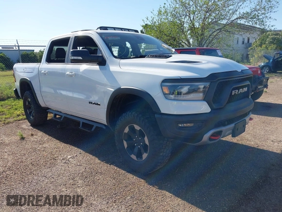 2019 Ram 1500 Rebel z VIN 1C6SRFLT5KN923837, wystawiony jako IAAI lot #41961921 z przebiegiem 68 400 mil mil oraz . Historia ofert i sprzedaży dostępna na DreamBid. Obrazek 1.