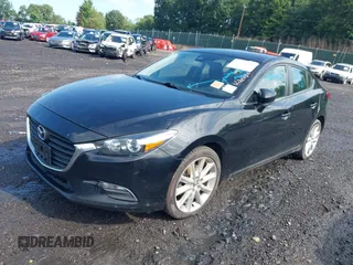2017 Mazda 3 Touring z VIN 3MZBN1V74HM128575, wystawiony jako IAAI lot #42731487 z przebiegiem 136 553 mil mil oraz . Historia ofert i sprzedaży dostępna na DreamBid. Obrazek 2.