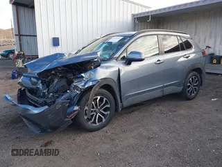 2023 Toyota Corolla Cross Hybrid S with VIN 7MUFBABG3PV005338, listed as a IAAI auction lot 41633311 with 32,082 mi miles and . Bid and sale history available at DreamBid. Image 2.